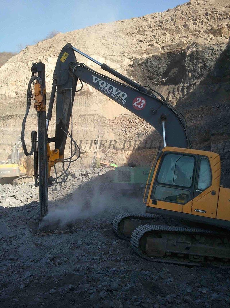 Excavator mounted rock drills