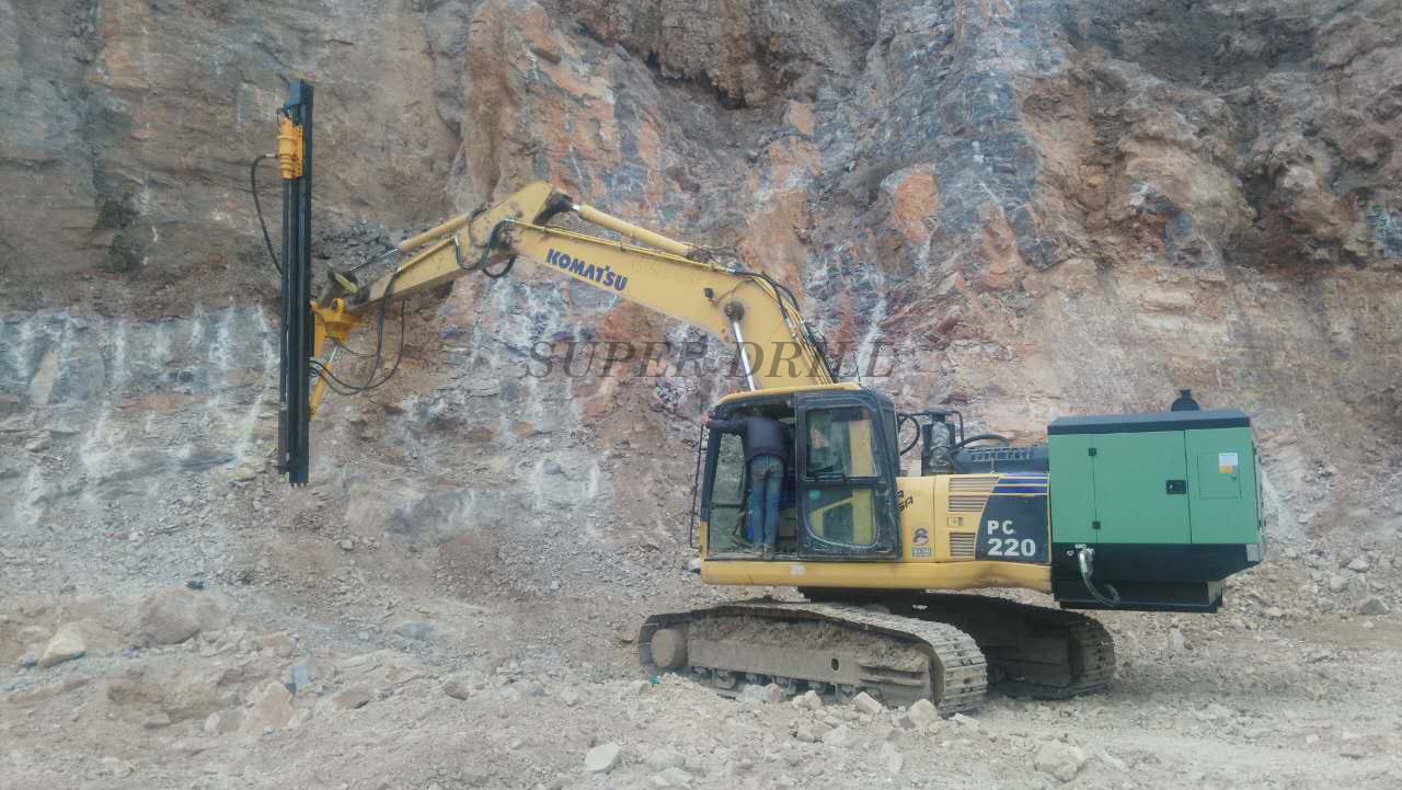 Excavator mounted rock drills